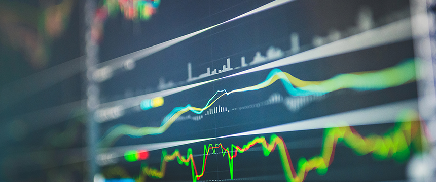 A close-up of a digital screen displaying multiple colorful financial graphs and charts, indicating market trends and data analysis in a corporate law office, supporting Chicago lawyers with litigation support.
