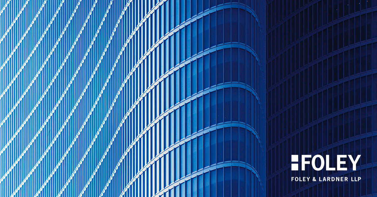 Curved modern glass building facade with vertical and horizontal lines, featuring the Foley & Lardner LLP logo in the lower right corner—an impressive corporate law office recognized for its lawyers in Chicago.