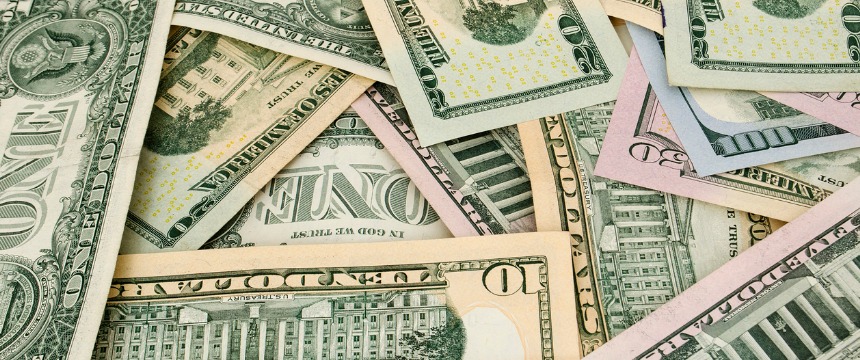 A pile of assorted U.S. dollar bills in various denominations, overlapping each other—ideal imagery for chicago lawyers offering litigation support in intellectual property law cases.