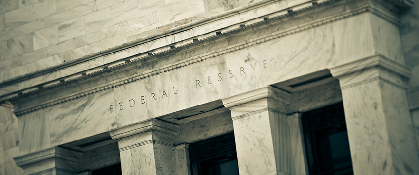 Close-up view of the marble facade of the Federal Reserve building, an iconic site often referenced by corporate law offices and lawyers in Chicago for matters relating to financial regulation.