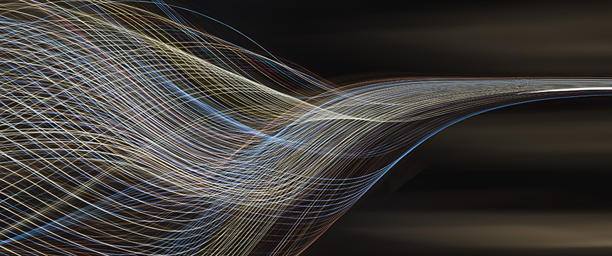 Curved, multicolored light trails on a dark background create an abstract, flowing pattern—an image reminiscent of the dynamic energy and complexity handled by top Chicago lawyers.