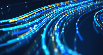 Abstract image showing curved lines of blue, yellow, and white light on a dark background, reminiscent of data streams flowing through a modern corporate law office.