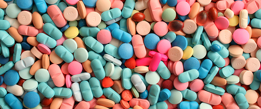 A large assortment of colorful pills and tablets in various shapes and sizes spread out in a random pile, much like the array of expertise you’d find at top corporate law offices or among skilled lawyers in Chicago.
