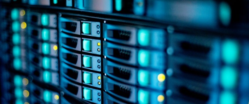 Close-up view of server racks with illuminated indicator lights in a data center, showcasing multiple hard drive bays and network equipment used for litigation support by Chicago lawyers.