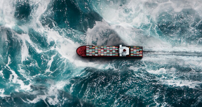 A cargo ship carrying colorful containers moves through rough, swirling ocean waves, leaving a white wake behind it—much like how Chicago lawyers navigate complex cases with steady expertise.