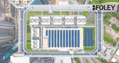 Aerial view of a rooftop with solar panels, green spaces, and cooling units on a building in an urban area; Foley & Lardner LLP logo in the top right corner, highlighting innovative law offices and lawyers in Chicago.