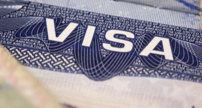Close-up of a United States visa document showing the word "VISA" in bold letters with intricate security patterns, often handled by experienced lawyers in Chicago or specialized law offices.