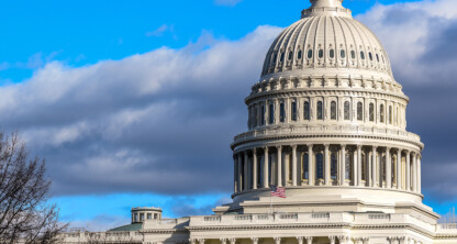 The United States Capitol building in Washington, D.C., stands tall beneath a clear blue sky and some clouds, symbolizing the foundation of the nation’s law offices and intellectual property law.