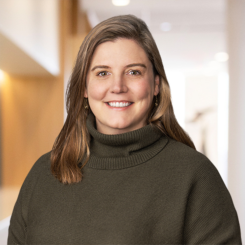 A woman smiling at the camera, representing lawyers in Chicago who specialize in litigation support and intellectual property law.