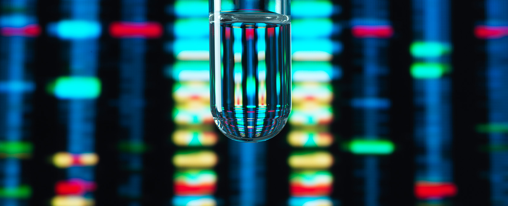 A test tube filled with clear liquid is shown in front of a blurred, colorful DNA sequencing pattern, evoking the precision and analytical approach found in top law offices and among leading lawyers in Chicago.