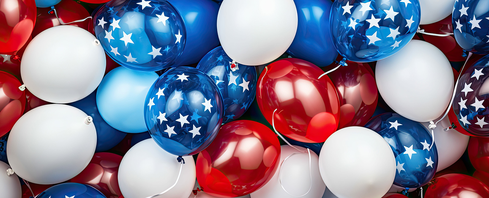 A cluster of red, white, and blue balloons, some with white stars on a blue background, creates a patriotic theme—perfect for celebrating law offices or lawyers in Chicago during special events.