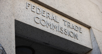 Stone building entrance with the words "Federal Trade Commission" engraved above the doorway.